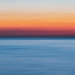 calm body of water during golden hour